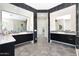 Modern bathroom featuring dual vanities, hexagon tile floor, and walk-in shower at 35348 N 87Th St, Scottsdale, AZ 85266