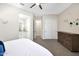 Bright bedroom with closet, ceiling fan, and view of the adjoining bathroom, perfect for a room at 35348 N 87Th St, Scottsdale, AZ 85266