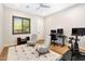 Stylish home gym/bedroom featuring modern decor, comfortable seating, and workout equipment at 35348 N 87Th St, Scottsdale, AZ 85266