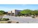Beautiful desert home with three-car garage and paved driveway surrounded by greenery at 35348 N 87Th St, Scottsdale, AZ 85266