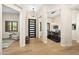 Bright foyer with hardwood floors leads to an elegant dining area and a comfortable sitting room at 35348 N 87Th St, Scottsdale, AZ 85266