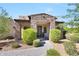 Beautiful front entry featuring stone accents, desert landscaping, and a modern front door at 35348 N 87Th St, Scottsdale, AZ 85266