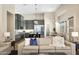 An open-concept kitchen featuring gray cabinetry, a black marble island, stainless steel appliances, and hardwood flooring at 35348 N 87Th St, Scottsdale, AZ 85266