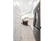 Bright laundry room featuring modern appliances, white cabinets, quartz countertops, and patterned tile flooring at 35348 N 87Th St, Scottsdale, AZ 85266