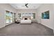 Spacious main bedroom with sitting area, plush carpet, and access to outdoor pool area at 35348 N 87Th St, Scottsdale, AZ 85266
