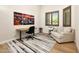 Bright home office with natural light, modern decor, and comfortable seating area at 35348 N 87Th St, Scottsdale, AZ 85266