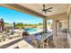 Beautiful covered patio featuring a dining area, lounge seating, and scenic backyard views at 35348 N 87Th St, Scottsdale, AZ 85266