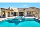 Backyard pool and spa with lush desert landscaping and covered patio area, ideal for relaxation at 35348 N 87Th St, Scottsdale, AZ 85266