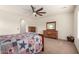 Comfortable bedroom features wood furniture, ceiling fan, and ample natural light at 3554 N Presidio Ct, Florence, AZ 85132