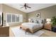 Relaxing main bedroom with neutral colors, comfortable decor, and shuttered windows at 3690 N 150Th Ave, Goodyear, AZ 85395