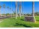 Sign for Eagle's Nest Clubhouse surrounded by palm trees, offering a welcoming and luxurious community gathering space at 3690 N 150Th Ave, Goodyear, AZ 85395