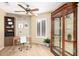 Inviting home office featuring built-in shelving, a modern desk, and ample natural light at 3690 N 150Th Ave, Goodyear, AZ 85395