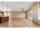 Living room view with tile flooring, modern fixtures, and a neutral color palette at 3690 N 150Th Ave, Goodyear, AZ 85395