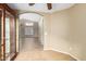 Open floorplan showing living room with tile flooring through arched doorway at 3690 N 150Th Ave, Goodyear, AZ 85395
