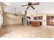 Spacious living room features tile flooring, ceiling fans, neutral paint, and an open floor plan at 3690 N 150Th Ave, Goodyear, AZ 85395