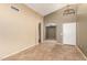 A spacious living room with vaulted ceilings, tile flooring, and neutral paint at 3690 N 150Th Ave, Goodyear, AZ 85395
