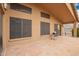 Covered patio featuring tiled floors and backyard views at 3690 N 150Th Ave, Goodyear, AZ 85395