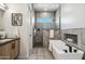 Spa-like bathroom features a soaking tub, separate shower, and modern vanity at 377 E Windsor Ave # 4, Phoenix, AZ 85004