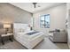 Bedroom featuring a modern bed, accent wall, and window with a view at 377 E Windsor Ave # 4, Phoenix, AZ 85004