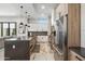 Modern kitchen featuring stainless steel appliances, center island and open floor plan at 377 E Windsor Ave # 4, Phoenix, AZ 85004