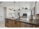 Open kitchen with stainless steel appliances, center island and modern light fixtures at 377 E Windsor Ave # 4, Phoenix, AZ 85004