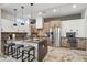 Modern kitchen featuring marble floors, center island with barstool seating and stylish pendant lighting at 377 E Windsor Ave # 4, Phoenix, AZ 85004