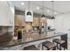 Modern kitchen with a large island, stainless steel appliances and stylish pendant lights at 377 E Windsor Ave # 4, Phoenix, AZ 85004
