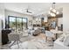Bright living room with modern furnishings, flowing into the kitchen and access to the patio at 377 E Windsor Ave # 4, Phoenix, AZ 85004