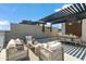 Stylish rooftop with dining and lounge seating, perfect for entertaining or relaxing outdoors at 377 E Windsor Ave # 4, Phoenix, AZ 85004