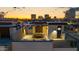 Rooftop terrace with outdoor dining table and lounge seating with city views during sunset at 377 E Windsor Ave # 4, Phoenix, AZ 85004