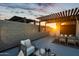 Rooftop patio with an outdoor dining and lounge area beneath a modern pergola at sunset at 377 E Windsor Ave # 4, Phoenix, AZ 85004