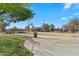 Enjoy a community basketball court surrounded by lush landscaping and a neighborhood setting at 393 S Soledad Ln, Casa Grande, AZ 85194