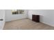 Well-lit bedroom with neutral carpet, window, and closet space for storage at 393 S Soledad Ln, Casa Grande, AZ 85194