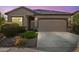 Charming single-story home featuring a neutral color palette, two-car garage, and desert landscaping at 393 S Soledad Ln, Casa Grande, AZ 85194