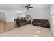 Spacious living room and dining area with neutral carpet, wood floors, and comfortable seating at 393 S Soledad Ln, Casa Grande, AZ 85194