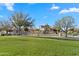 Wonderful community park featuring a playground and walking paths through green spaces for residents at 393 S Soledad Ln, Casa Grande, AZ 85194