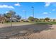 Community sand volleyball court for a friendly game in the neighborhood with surrounding green space at 393 S Soledad Ln, Casa Grande, AZ 85194