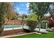 Beautiful backyard oasis with a sparkling pool, lush landscaping, and mountain views in the distance at 4010 E Montebello Ave, Phoenix, AZ 85018