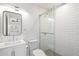 Bathroom with a white vanity, toilet, and a stand-up shower with glass doors at 4010 E Montebello Ave, Phoenix, AZ 85018