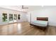 Light-filled bedroom features a unique wooden bed frame and French doors to the yard at 4010 E Montebello Ave, Phoenix, AZ 85018