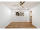 Bedroom with a ceiling fan, window, walk in closet and wood floors at 4010 E Montebello Ave, Phoenix, AZ 85018