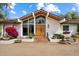 Inviting front entrance with modern double doors, ample natural light, and desert landscaping at 4010 E Montebello Ave, Phoenix, AZ 85018