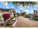 Spacious front yard featuring desert landscaping and a long driveway leading to the home at 4010 E Montebello Ave, Phoenix, AZ 85018
