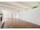 Bright, airy living room with hardwood floors, modern lighting, and stained glass accents at 4010 E Montebello Ave, Phoenix, AZ 85018