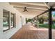 Covered patio featuring tile flooring and a ceiling fan, perfect for outdoor entertaining and relaxation at 4010 E Montebello Ave, Phoenix, AZ 85018