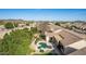 An aerial view of a desert home with a swimming pool surrounded by mature landscaping at 4614 W Fallen Leaf Ln, Glendale, AZ 85310