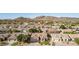 An aerial view of the property showcasing the desert landscape and nearby mountains at 4614 W Fallen Leaf Ln, Glendale, AZ 85310