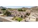 A high angle shot shows the desert landscaping of this charming home with three-car garage at 4614 W Fallen Leaf Ln, Glendale, AZ 85310