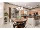 Bright eat-in kitchen featuring natural light, a round dining table, and views to the outside at 4614 W Fallen Leaf Ln, Glendale, AZ 85310