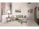 Comfortable living room with neutral tones, carpet, and natural light from large windows at 4614 W Fallen Leaf Ln, Glendale, AZ 85310